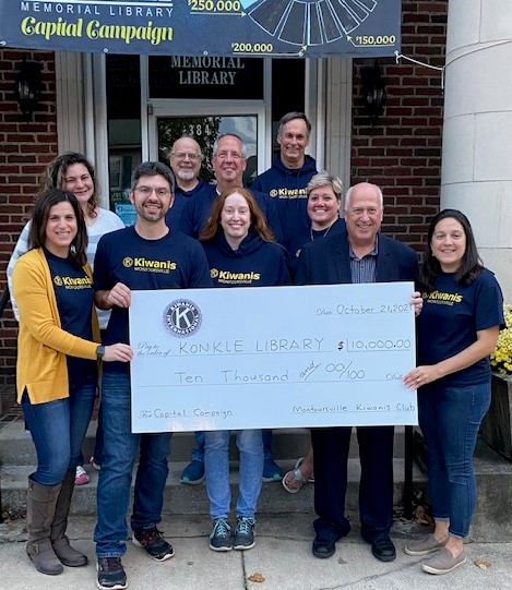 montoursville kiwanis club presents a check to konkle library